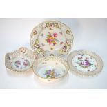 Four German reticulated baskets or dishes, all decorated with floral designs,