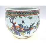 A famille verte planter or jardiniere, decorated with Manchu/Chinese figures at leisure,