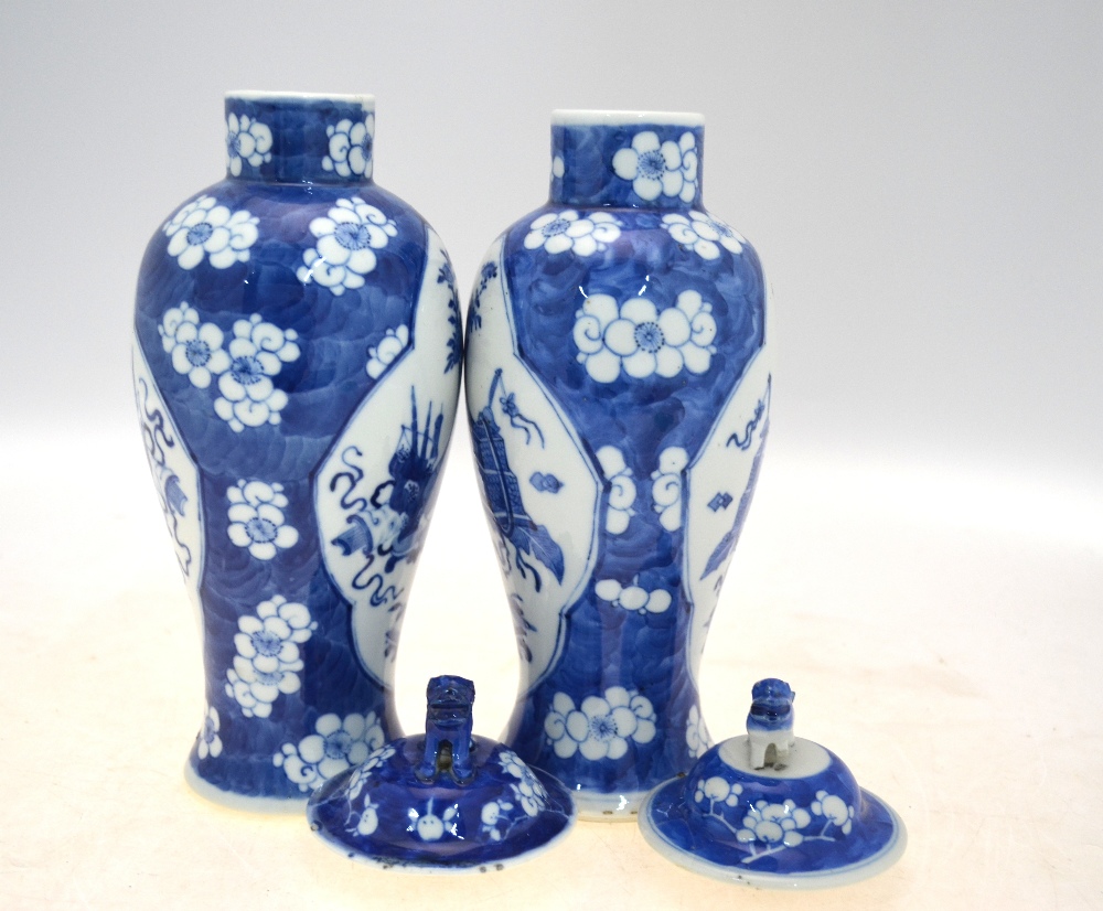 A pair of blue and white vases and covers; 26 cm high; each base with a Kangxi four-character mark, - Image 3 of 8