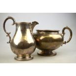 A Victorian silver milk and sugar pair with scroll handles and beaded rims, on flared foot,