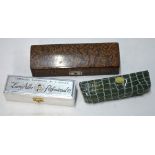 A Goulding & D'Almaine ivory mounted boxwood clarinet with brass keys to/w three boxed Hohner