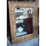 An 18th century style carved giltwood, gesso frame with later mirrored plate,