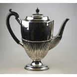An oval silver half-reeded coffee pot in the Adam manner, with composition handle of finial,