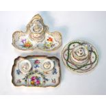 Three Dresden encriers, all decorated with floral motifs: one of rectangular,