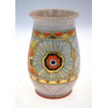 A Charlotte Rhead oviform vase, decorated in orange, black, yellow and gilt with bold petal designs,
