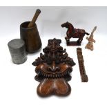 A collection of ethnographia, including a richly-carved grotesque mask two piece wall bracket,