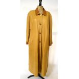 A pale sand-coloured soft leather full length lady's coat with tan collar and cuffs and oatmeal