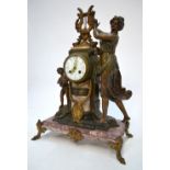 A French gilt bronze patinated spelter figural mounted drum mantel clock,