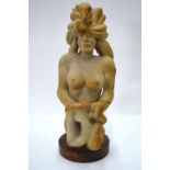A J Watts - East African stone sculpture of a female nude, approx 72 cm high,