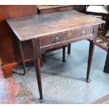 An 18th century oak side table, the three plank top with moulded edge over a frieze drawer,