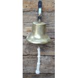 A brass bell, 20 cm diameter,