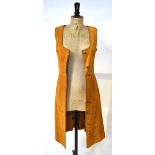 A 1970s mustard suede long waistcoat,