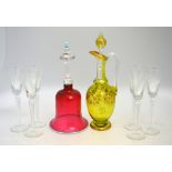 A set of six Champagne flutes; together with a cranberry glass bell,