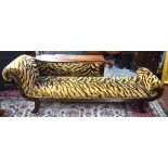 A Victorian style mahogany framed scroll end chaise longue upholstered in faux tiger pattern and of