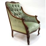 A late 19th/20th century moulded walnut framed upholstered salon armchair