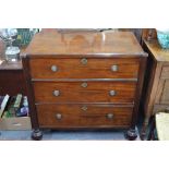 A 19th century mahogany commode having three long drawers flanked by fluted full-height pilasters,