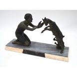 An Art Deco patinated spelter group of a classical young woman with a kid-goat, on marble base,