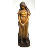 A Goldscheider cold painted terracotta figure of a young maiden, titled 'Mignon', incised signature,