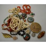 A collection of vintage jewellery including simulated pearls, chalcedony beads, brooches, necklaces,