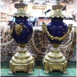 A pair of late 19th/20th century French gilt bronze mounted blue porcelain vases, table lamps,