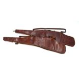 Two leather slip cases for shotguns with sheepskin liners (2)