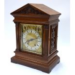 W & H & Son, a late 19th century walnut cased architectural cased eight-day mantel clock,