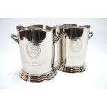A pair of nickel-plated cylindrical champagne ice-buckets with twin handles,