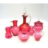 Victorian and later cranberry glass comprising five jugs and three vases (7)