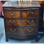 A Georgian style mahogany serpentine form chest of two short over two long graduated drawers