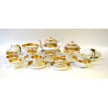 A Ridgway early Victorian tea/coffee service, decorated with a gilded burnt orange and peach border,