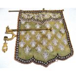 A shield-shaped screen beaded with repeating fleur-de-lys design complete with foliate gilded pole