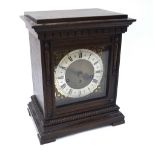 A continental oak cased eight-day mantel clock,