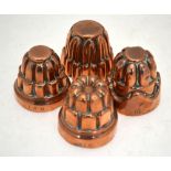 Four Victorian copper small jelly-moulds, each 5.