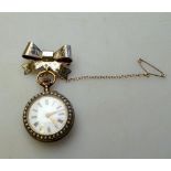 A Swiss 800 grade and gilt lady's fob watch with enamel dial and top-wind movement,