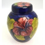 A Moorcroft ginger jar and cover, blue ground decorated with the 'Hibiscus' pattern,