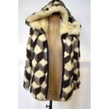 A patchwork coney fur jacket with fur-lined hood in white/grey/brown, 47 cm across chest,