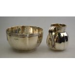 An Edwardian sugar basin of lobed form and reeded rim to/w a matching cream jug,