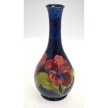 A Moorcroft ovoid vase with long neck, blue ground decorated with the 'Hibiscus' pattern,