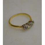 A three-stone old cut diamond ring 18ct yellow and white gold claw setting Condition