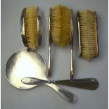 A five-piece silver-backed brush set with engine-turned decoration, Birmingham 1913,