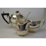 An oval half-reeded silver three-piece tea service, H V Pithey & Co, Birmingham 1911/12, 27.