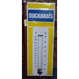 An enamel Duckhams advertising sign (lacks original thermometer),