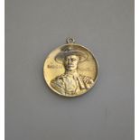 A pendant featuring Baden Powell and motto 'Justice and Empire'