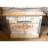 A 19th century continental pine chest of two short over two long graduated drawers in distressed