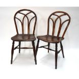 A pair of 19th century elm bentwood chairs having gothic arched backs (2)