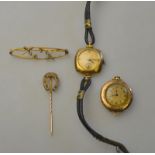 Collection of old gold items including two watches, horse shoe stick pin and bar brooch,