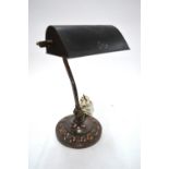 A vintage weighed coppered adjustable desk lamp