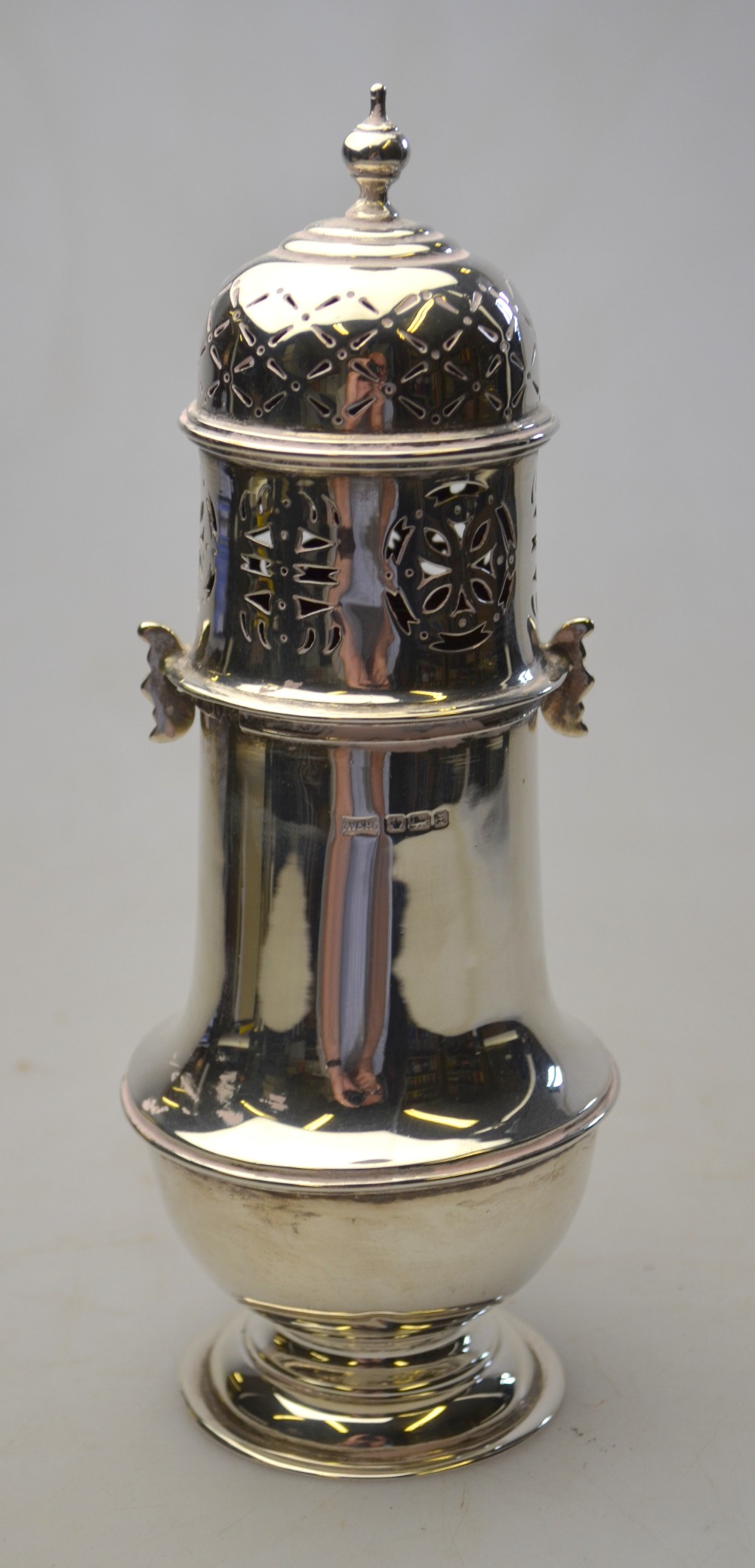 A baluster sugar caster with pierced top and bayonet fitting, Sheffield 1915, 7.