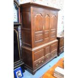 An 18th century oak press cupboard in two parts,