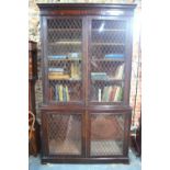 A George III mahogany library bookcase in two parts,